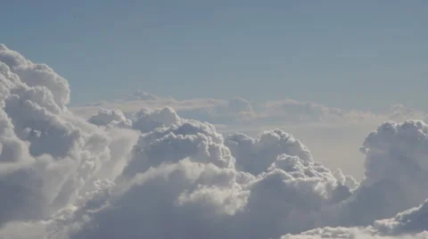 Clouds and sky as seen through window of an aircraft at sunrise Video stock 68742999