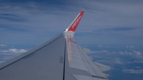 Clouds and sky as seen through a window of an aircraft flying Stock Footage 99105469