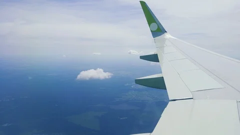 Clouds and sky as seen through window of an aircraft 動画素材 107533365