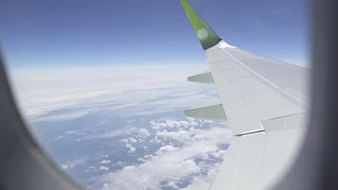 Clouds and sky as seen through window of an aircraft Stock Footage 107533487