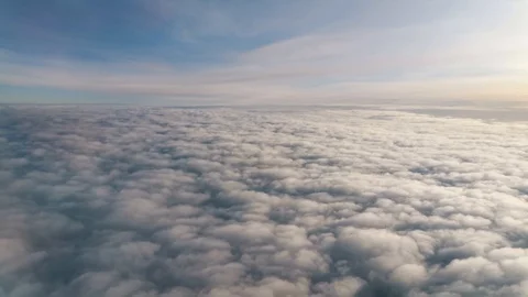 Clouds and sky as seen through window of an aircraft Видео 127640545