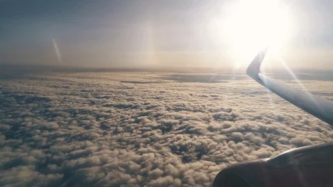 Clouds and sky as seen through window of an aircraft Stock-Footage 127640550