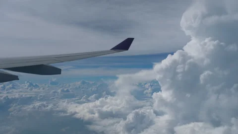 Clouds and sky seen through an airplane window Stock Footage 296242017