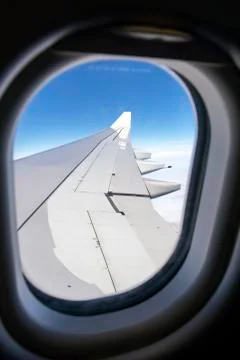 Clouds and sky as seen through window of an aircraft Stockfoto's