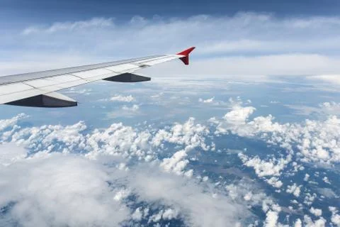 Clouds and sky as seen through window of an aircraft Stock Photos