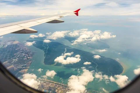 Clouds and sky as seen through window of an aircraft Stock Photos