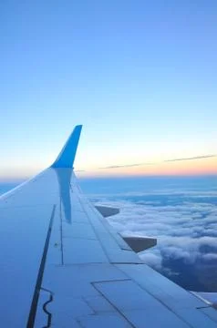 Clouds and sky as seen through window of an aircraft Stock Photos