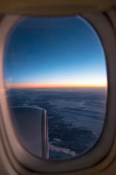 Clouds and sky as seen through window of an aircraft Foto stock