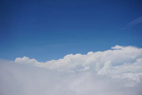Clouds and sky as seen through window of an aircraft Stock Photos