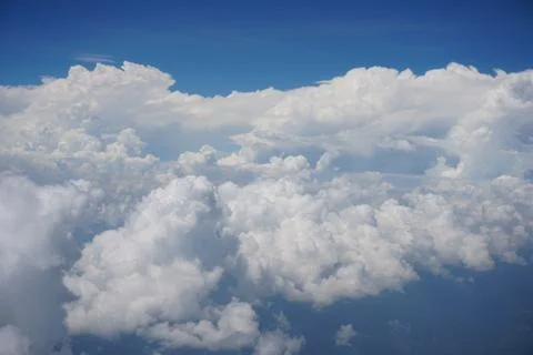 Clouds and sky as seen through window of an aircraft Stock Photos
