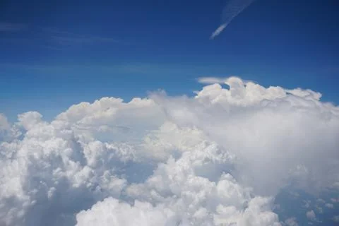 Clouds and sky as seen through window of an aircraft Stock Photos