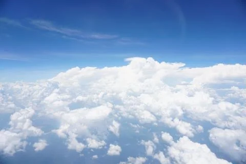 Clouds and sky as seen through window of an aircraft Stock Photos