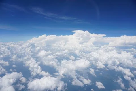 Clouds and sky as seen through window of an aircraft Stock Photos