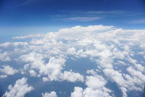 Clouds and sky as seen through window of an aircraft Stock Photos
