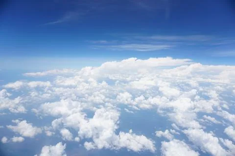 Clouds and sky as seen through window of an aircraft Stock Photos