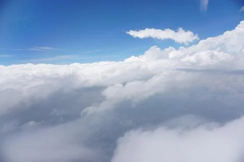 Clouds and sky as seen through window of an aircraft Stock Photos