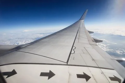 Clouds and sky as seen through window of an aircraft Stock Photos