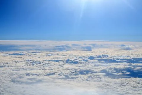 Clouds and sky as seen through window of an aircraft Fotos de archivo