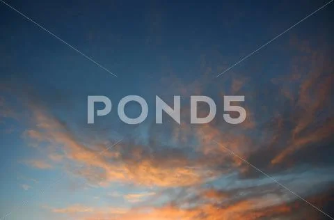 Clouds and sky at sunset Stock Photos