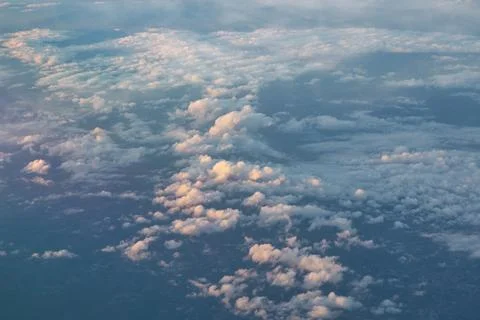 Clouds and sky view from window of an aircraft Stock Photos