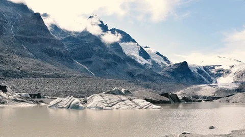 Clouds and snowbreak water moving in Grossglockner glacier in Alps Stock Footage 111942884