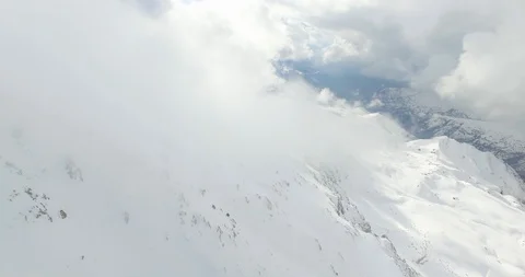 Clouds and Snowy Mountain at Sunset Stock Footage 118957453