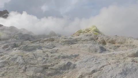Clouds and steam drifting over a volcano sulphur pot Stock Footage 245038623