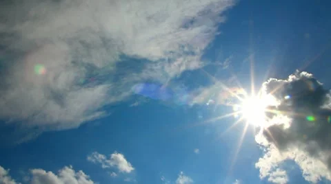 Clouds and sun on blue sky Stock Footage 8677552