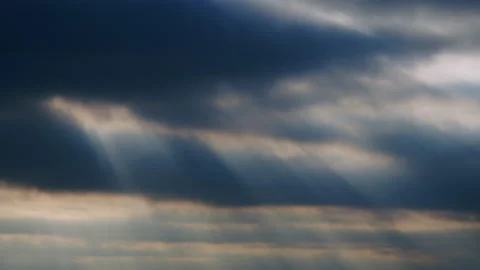 Clouds and sun rays in dark sky. Clouds ... | Stock Video | Pond5