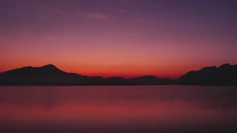 Clouds and the sun rising in the sky Stock Footage 263471941