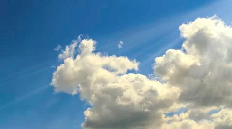 Clouds and sunbeams Stock Photos