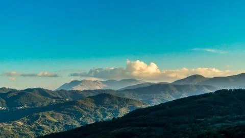 Clouds And Sunset Captured In The Mountains Stock Photos