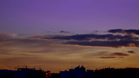 Clouds and Sunset in the city - Time Lapse Stock Footage 10942184