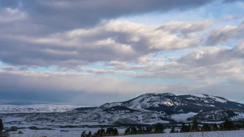 Clouds and sunset light over rounded mountains Crazy Mountains Stock Footage 167046153