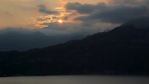 Clouds and sunset over mountains, Lake Como, Italy Stock Footage 260481664