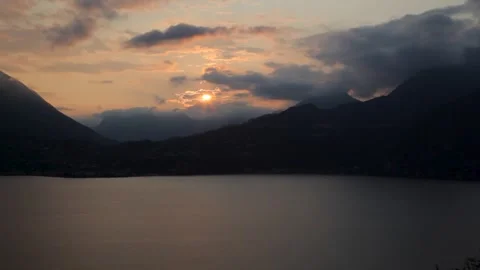 Clouds and sunset over mountains, Lake Como, Italy Stock Footage 260481722