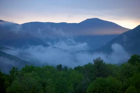 Clouds and sunset over mountains in stowe, vermont. Stock Photos
