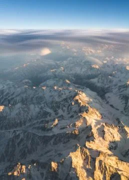 Clouds and sunset plane window view in Caucasus Stock Photos