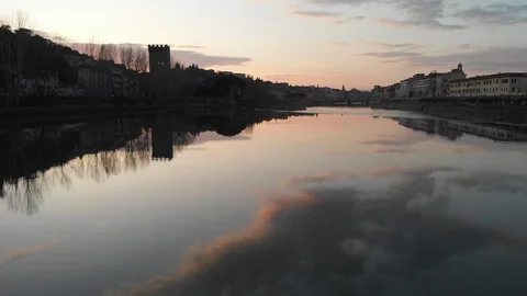 Clouds and Sunset reflection over the Arno river in Italy. Stock Footage 125706216