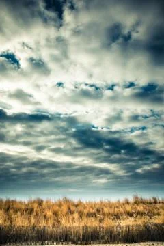 Clouds and Tall Grass Stock Photos