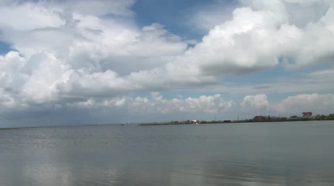 Clouds and their reflection are in a salt estuary Stock Footage 36167267
