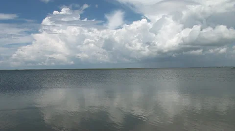 Clouds and their reflection are in a salt estuary Stock Footage 36167274