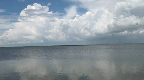 Clouds and their reflection are in a salt estuary Stock Footage 36167300