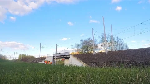Clouds and trains on rails in the spring timelapse 스톡 동영상 82986174