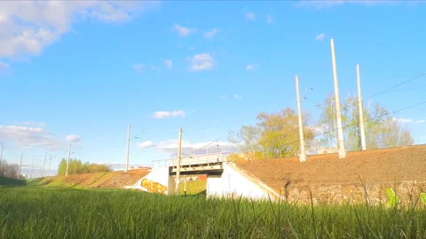 Clouds and trains on the rails in spring timelapse Stock Footage 87219330