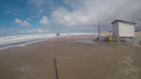 Clouds and waves advancing on sandy beach on a stormy day on the coast Stock Footage 146744668