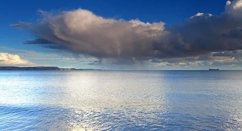 Clouds and waves Stock Photos