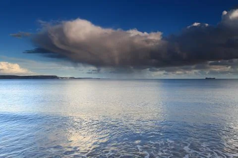Clouds and waves Stock Photos