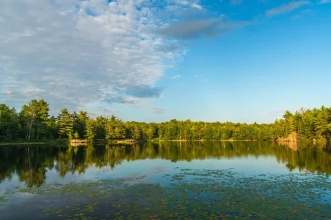 Clouds and wind moving over lake Stock Footage 128600907