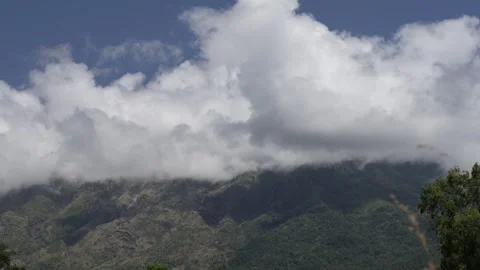 The clouds are blown around the mountains. Stock Footage 255998318
